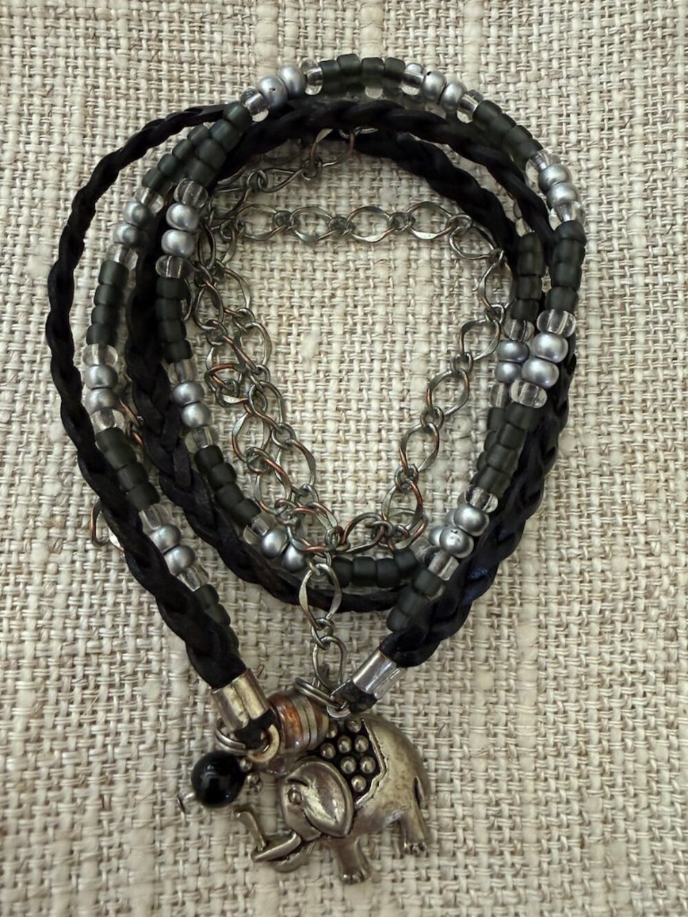 Silver wrap leather chair bracelet with elephant accent